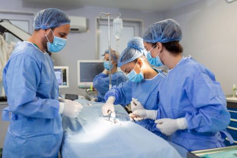 oksurgeons-operating-lighting-equipment-male-female-doctors-are-wearing-blue-scrubs-they-are-working-hospital